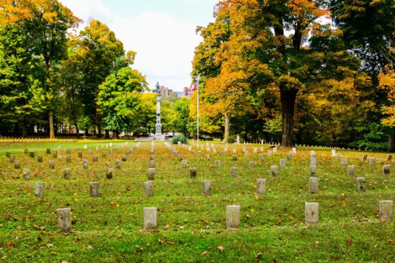 Grave markers extend in rows at the Confederate Cemetery in Fayetteville, Arkansas.