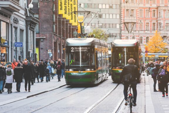 Crowded Street Scene with Tram and Cyclist in Helsinki Helsinki locals commuting in the streets of Central Helsinki