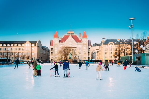 Winter Fun: Children Ice Skating in a Public Rink in Helsinki, Finland Children on a skating rink in Helsinki, Finland.
