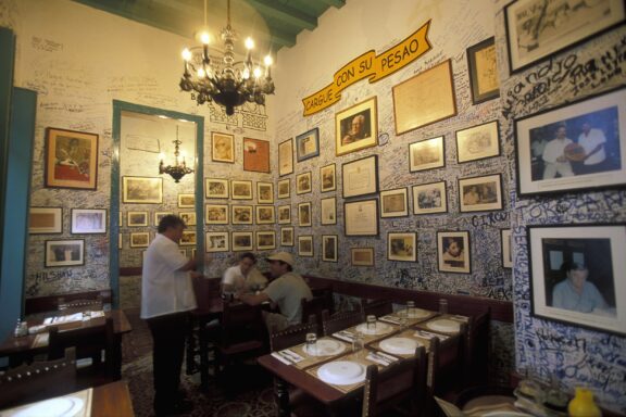 Interior of La Bodeguita del Medio with Walls Covered in Frames Inside the La Bodeguita del Medio in Havana