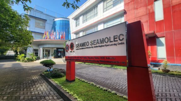 A sign can be seen outside of a building of Universitas Terbuka in Jakarta, Indonesia.