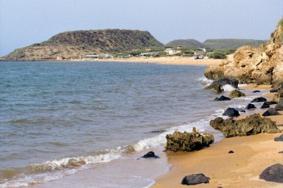 Coastal Landscape with Sandy Beach and Rocky Shoreline Beaches of Khor Amado
