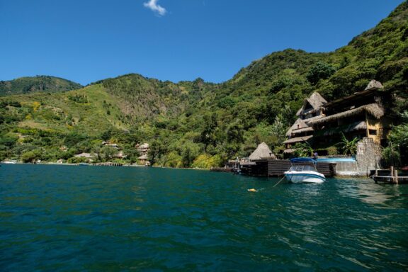 Lake Atitlan, Guatemala with Boats and Hills Lake Atitlán, a caldera lake, formed by a volcanic eruption approximately 84,000 years ago