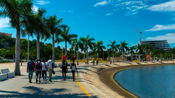 Group of People Walking Along the Waterfront Promenade in Luanda, Angola on a Sunny Day People walking in Luanda, the capital of Angola.
