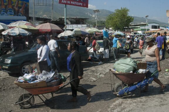 Street vendors carrying goods in Port-au-Prince