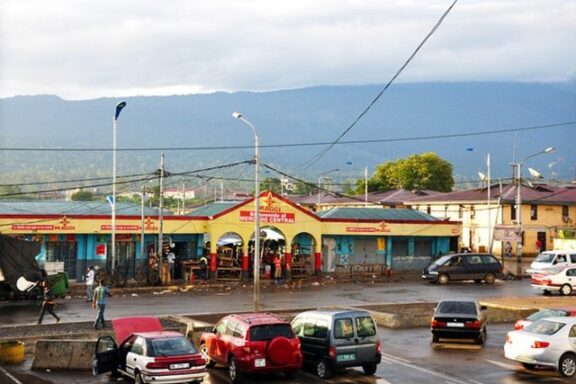 Street View of Mercado Central in Malabo with Cars and Pedestrians Daily life in Malabo near Mercado Central