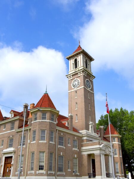 A low-angle view of the Monroe County Courthouse in Clarendon, Arkansas.