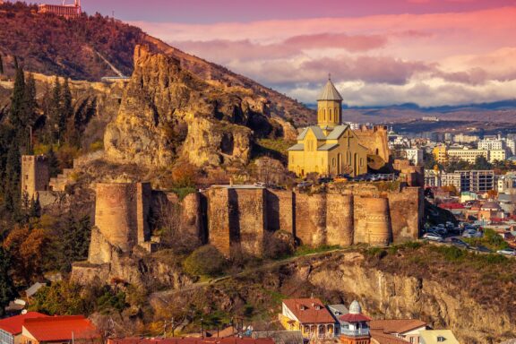 Narikala Fortress Overlooking Tbilisi at Sunset Beautiful panoramic view of Narikala Fortress in Tilisi