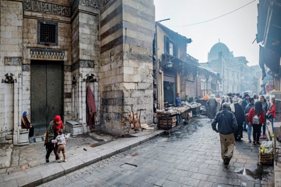 Bustling Street Scene in Old Town Cairo with Locals Cairo locals commuting in the streets of Old Town