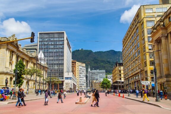 Pedestrians on Jimenez Avenue in Bogota with Mountains in the Background Bogota colombia october 11 2017: unidentified people walking in