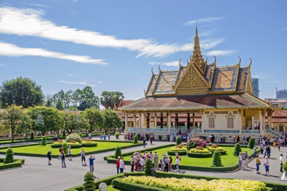 Visitors at a Traditional Pavilion with Landscaped Gardens under a Blue Sky Phochani Pavilion versatile venue within the Royal Palace complex