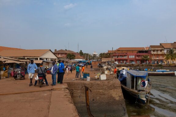 Bustling Port Scene with People and Boats Porto Pidjiguiti, Bissau