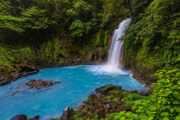 Waterfall and natural pool in Celeste River (Rio Celeste)