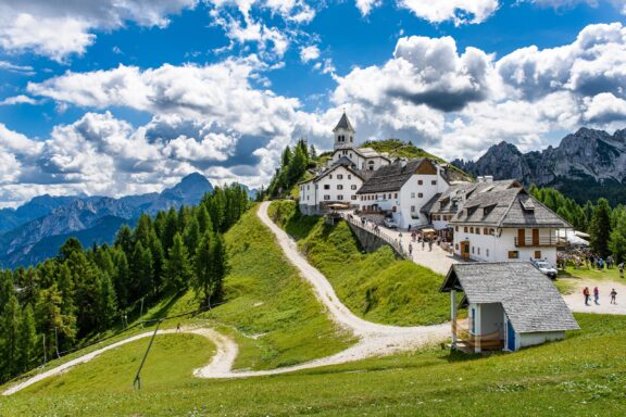 Monte Lussari Sanctuary looks out over the green landscape in Northeastern Italy.