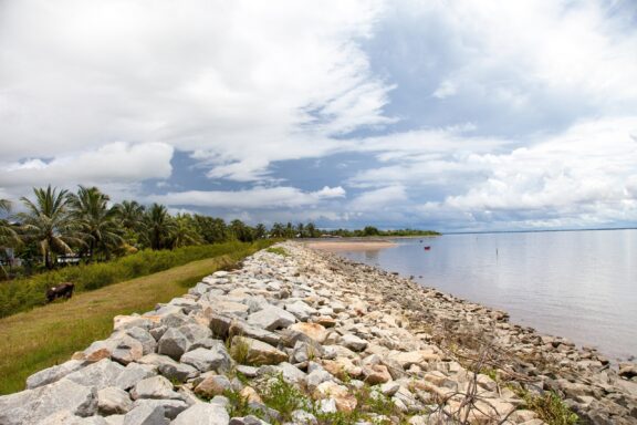 Seawall and Cloudy Sky in Guyana Sea wall of rocks near Georgetown