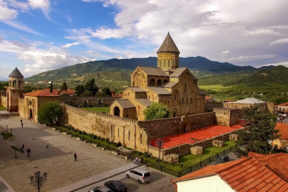 Svetitskhoveli Cathedral in Mtskheta with Mountainous Backdrop Svetitskhoveli Cathedral in the Mtskheta region