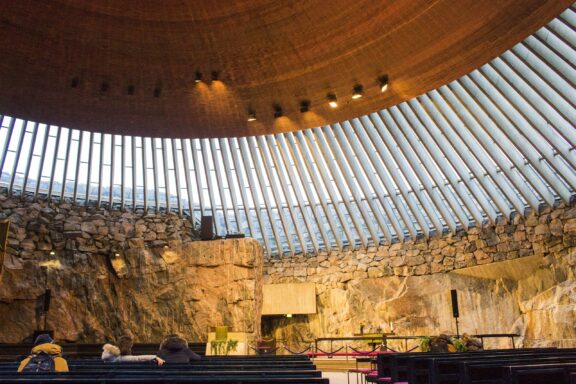 Interior View of Temppeliaukio Church with Natural Rock Walls Inside the Temppeliaukion Kirkko Church