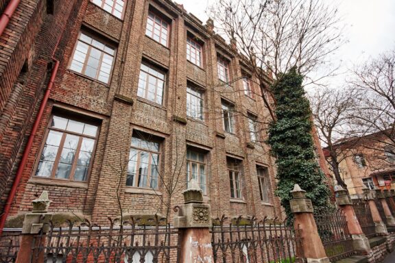 Brick Building with Gothic Architecture Resembling Hogwarts The "Georgian Hogwarts" gymnasium in Tbilisi