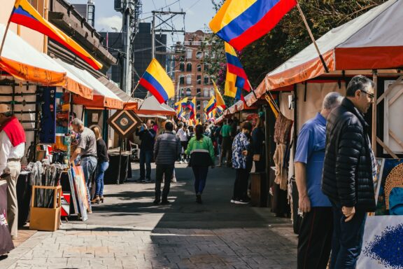 Flea Market Stalls with Visitors and Flags People shopping in the Usaquén Flea Market