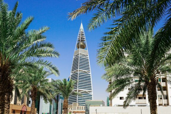 Al Faisaliyah Center Tower Amidst Palm Trees The Al Faisaliyah Center Skyscraper, the first of the ultra-modern high-rise buildings to be constructed in the Saudi Arabia