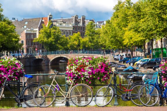 Bicycles on a bridge over the canals of Amsterdam.