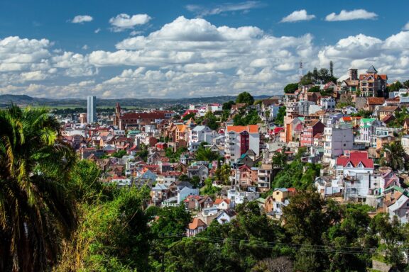 Hillside Cityscape with Colorful Buildings under Blue Sky Skyline on a cloudy day in the city of Antananarivo