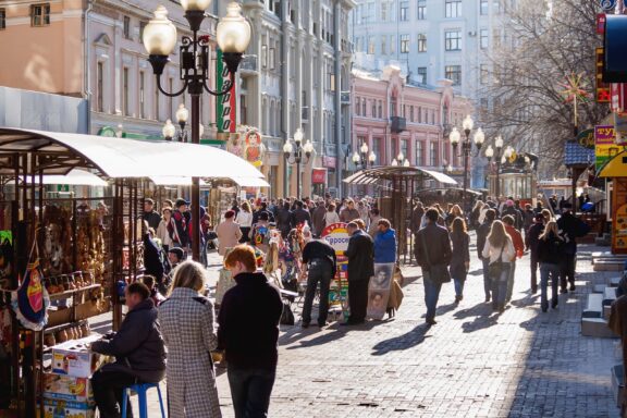 People stroll through Arbat street in the historical center of Moscow