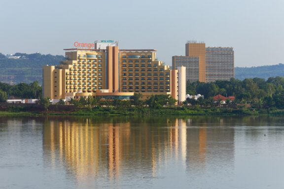 Cityscape Reflection on Water at Dusk One of the commercial areas in Bamako