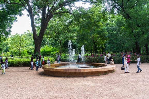 Fountain in a Park with Visitors Fountain in the National Park of Mali, Bamako