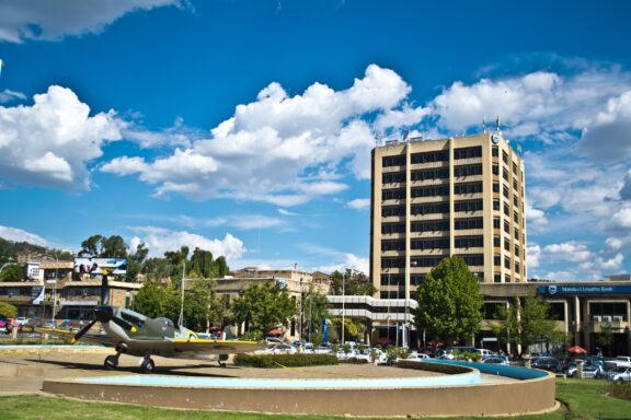 Urban Park with Memorial Statue and High-rise Building WW1 Memorial in Maseru, located in the Makoanyane Square