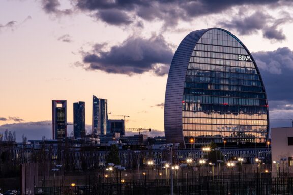 Dusk View of BBVA Bank Headquarters in Madrid Financial district of Madrid with BBVA bank in the foreground