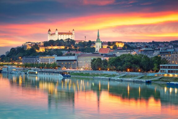 Cityscape of Bratislava with the Danube River in the foreground