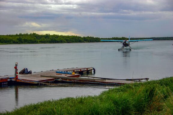 A float plane travels on the Naknek River in the Bristol Bay Borough of Alaska.