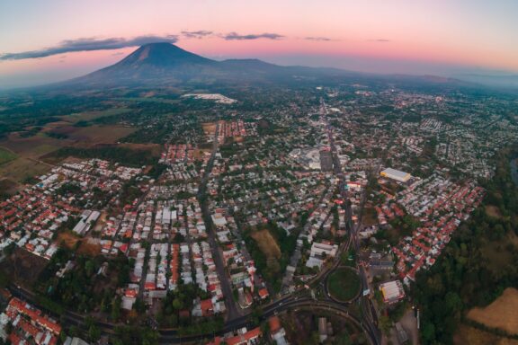 city ​​of san miguel, el salvador with chaparrastique volcano in the background at morning from aerial view