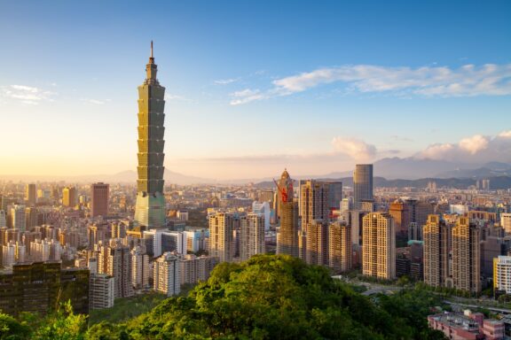 The Taipei 101 building stands tall in the skyline of Taipei, Taiwan.