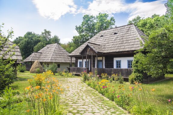 Traditional Village Houses with Thatched Roofs and Garden Pathway Dimitrie Gusti National Village Museum, established in 1936