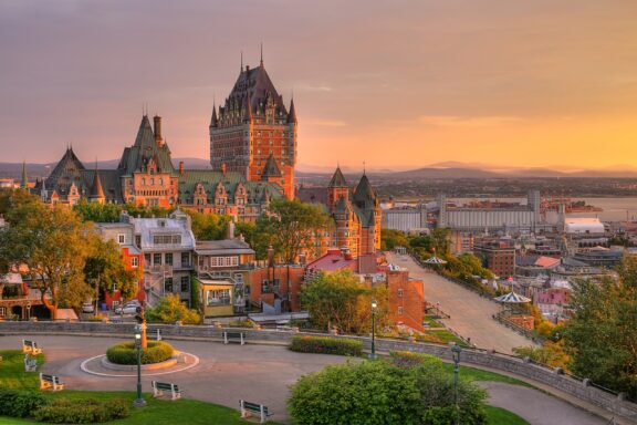 Frontenac Castle stands against a sunset sky in the Historic District of Old Québec.