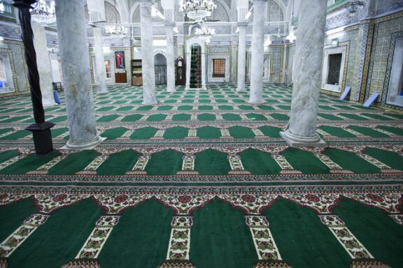 Interior View of Gurgi Mosque with Ornate Columns and Carpet Gurgi Mosque, commissioned by Mustafa Gurgi