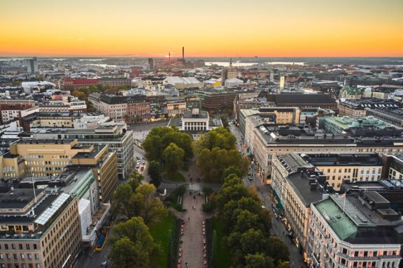 The sun sets behind Esplanade Park in central Helsinki, Finland. 