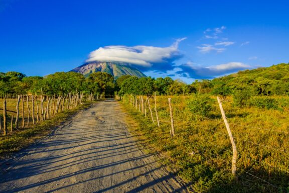 A volcano can be seen topped by a cloud on Ometepe Island in Nicaragua. 