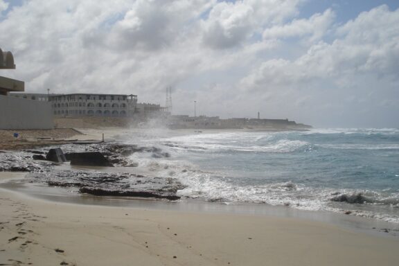 Waves Crashing on Rocky Shoreline at Janzour Beach This popular beach area is located west of Tripoli in the suburb of Janzour.