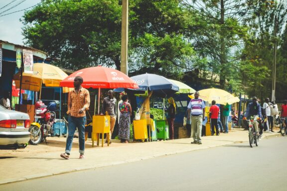 Street Scene with Locals and Vendors in Kigali Locals commuting on busy streets with street vendors