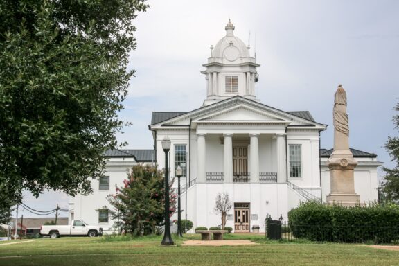 A view of the front of the Lowndes County Courthouse on a cloudy day.