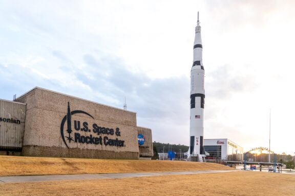 A rocket stands tall next to the US Space and Rocket Center in Huntsville, Alabama.