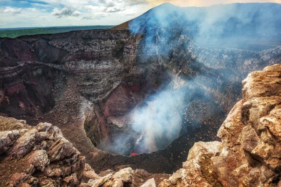 Masaya Volcano Crater Emitting Smoke Masaya Volcano National Park, one of Nicaragua's most active volcanoes