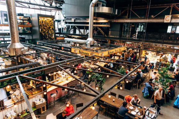 A variety of food producers, specialty shops, restaurants and cafes inside the Mathallen Oslo