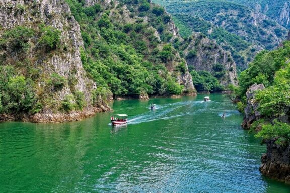 Boats enjoying the scenery in Matka Canyon on the banks of Treska River.