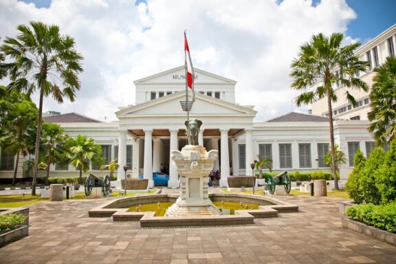 National Museum Building with Flag and Fountain The main gate of the National Museum of Indonesia