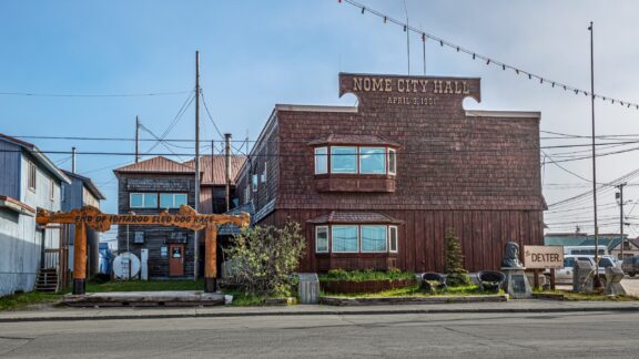 A view of the Nome City Hall building in Nome, Alaska on a sunny day.