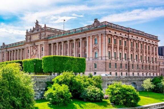 Stockholm Parliament Building on a Sunny Day The Swedish Parliament, open to visitors, and guided tours are offered in multiple languages